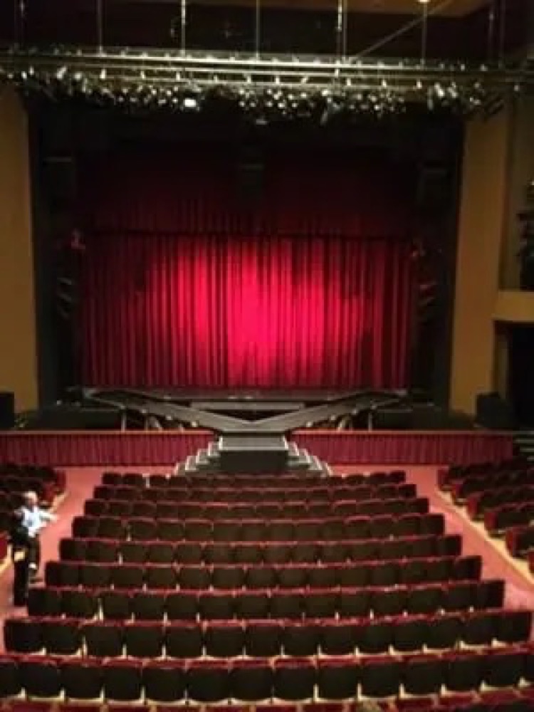 Theater with a red stage curtain