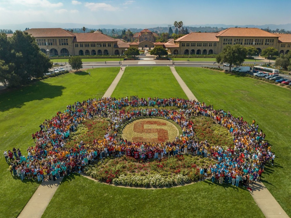 New students gathered around the Stanford S on the Oval
